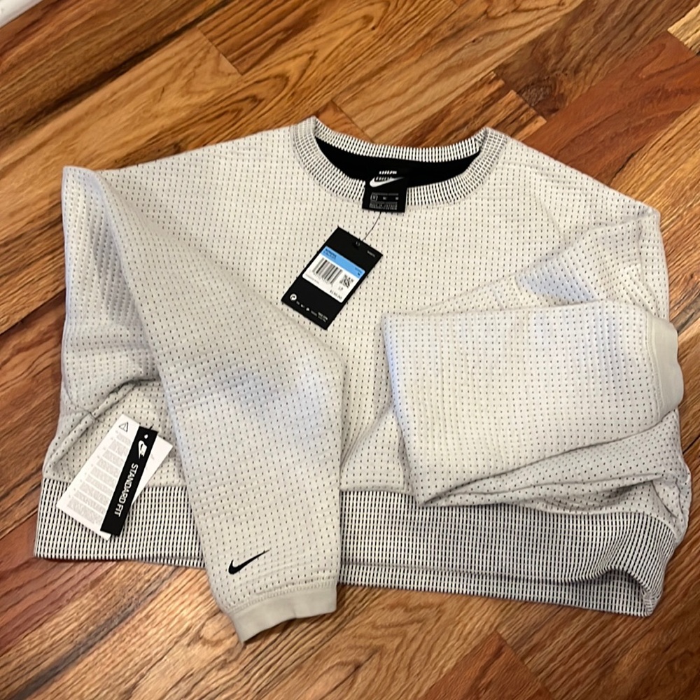 Womens Nike size medium cropped sweatshirt.